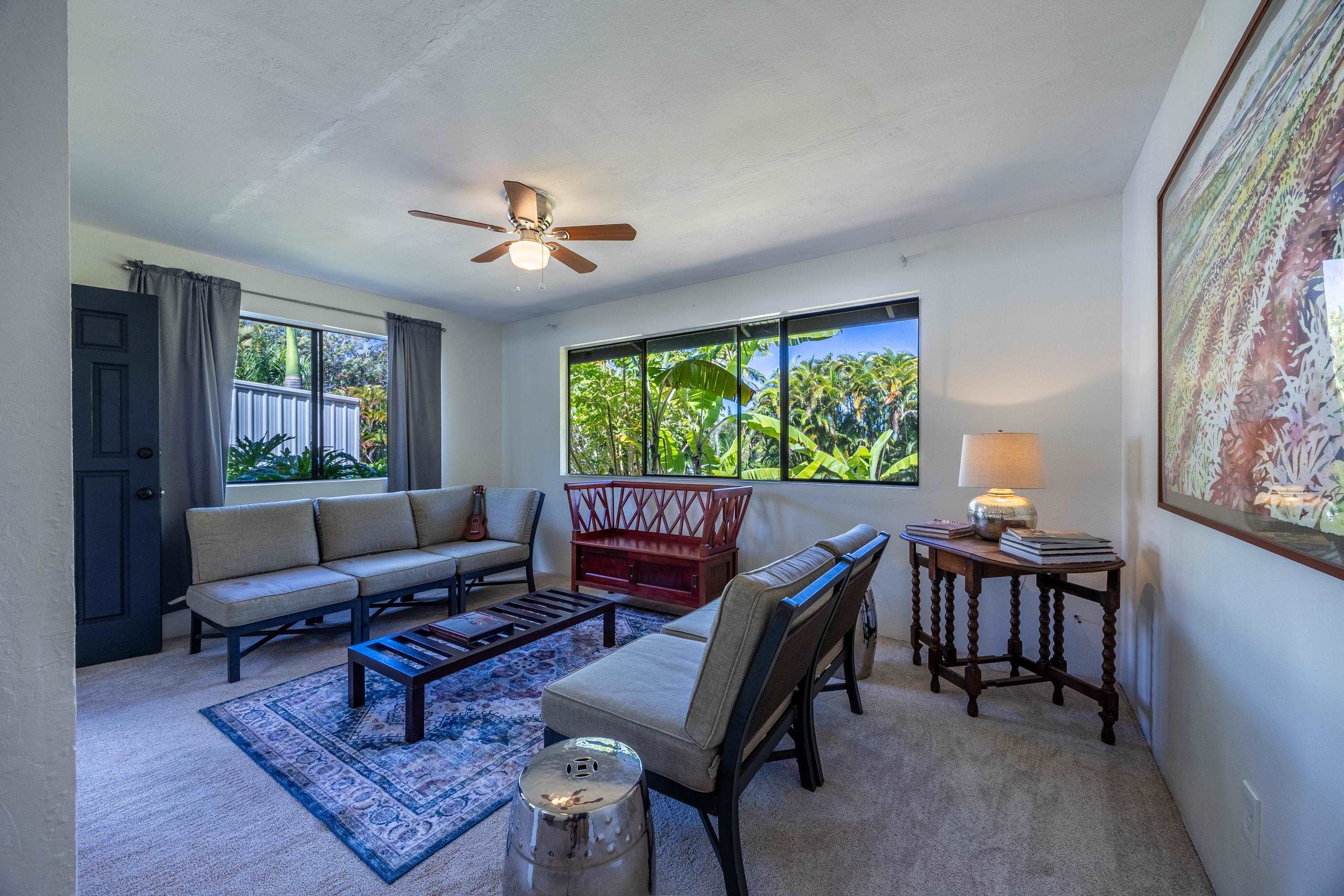 81 Kapuai Road Haiku, HI 96708 - Photo 12 of 50 a living room with furniture and a window