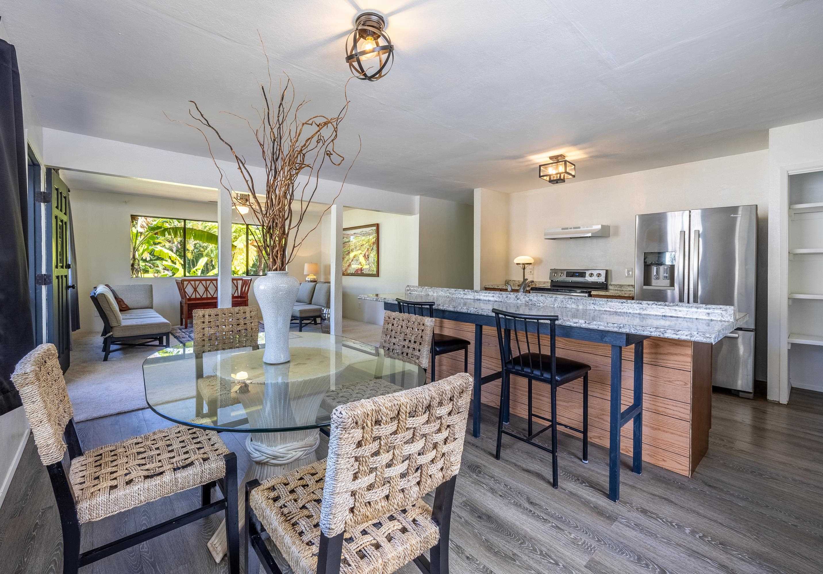 81 Kapuai Road Haiku, HI 96708 - Photo 16 of 50 a view of a dining room with furniture and wooden floor