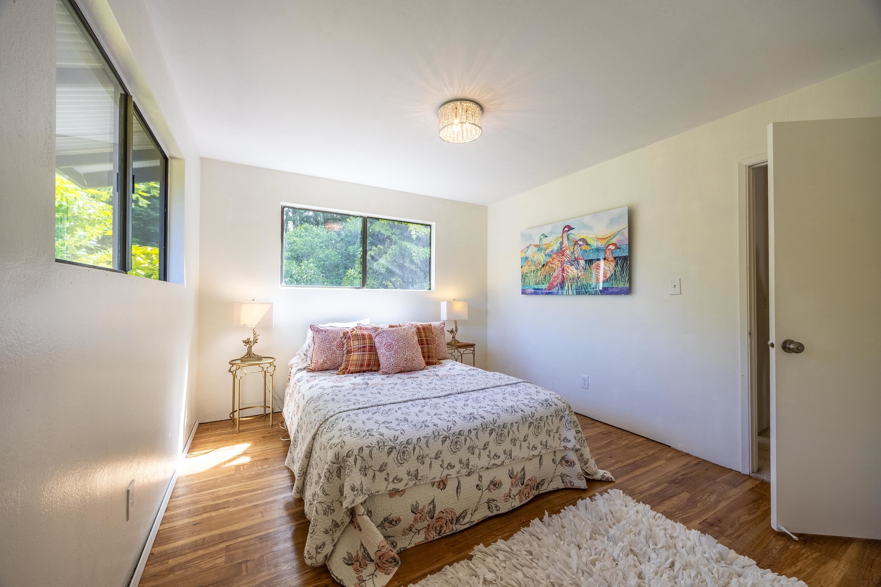 81 Kapuai Road Haiku, HI 96708 - Photo 21 of 50 a bedroom with a bed and a window