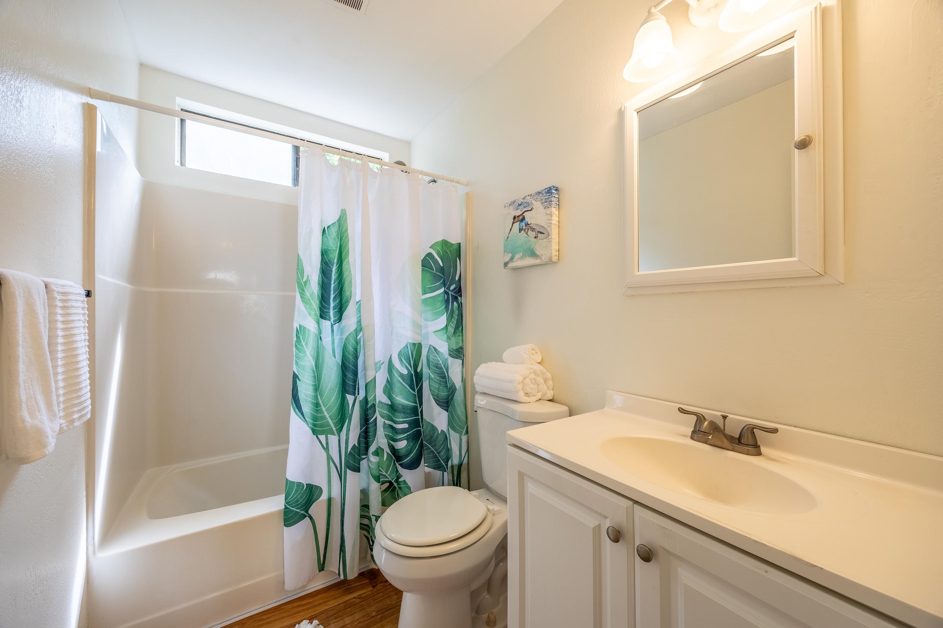 81 Kapuai Road Haiku, HI 96708 - Photo 22 of 50 a bathroom with a sink and mirror with toilet