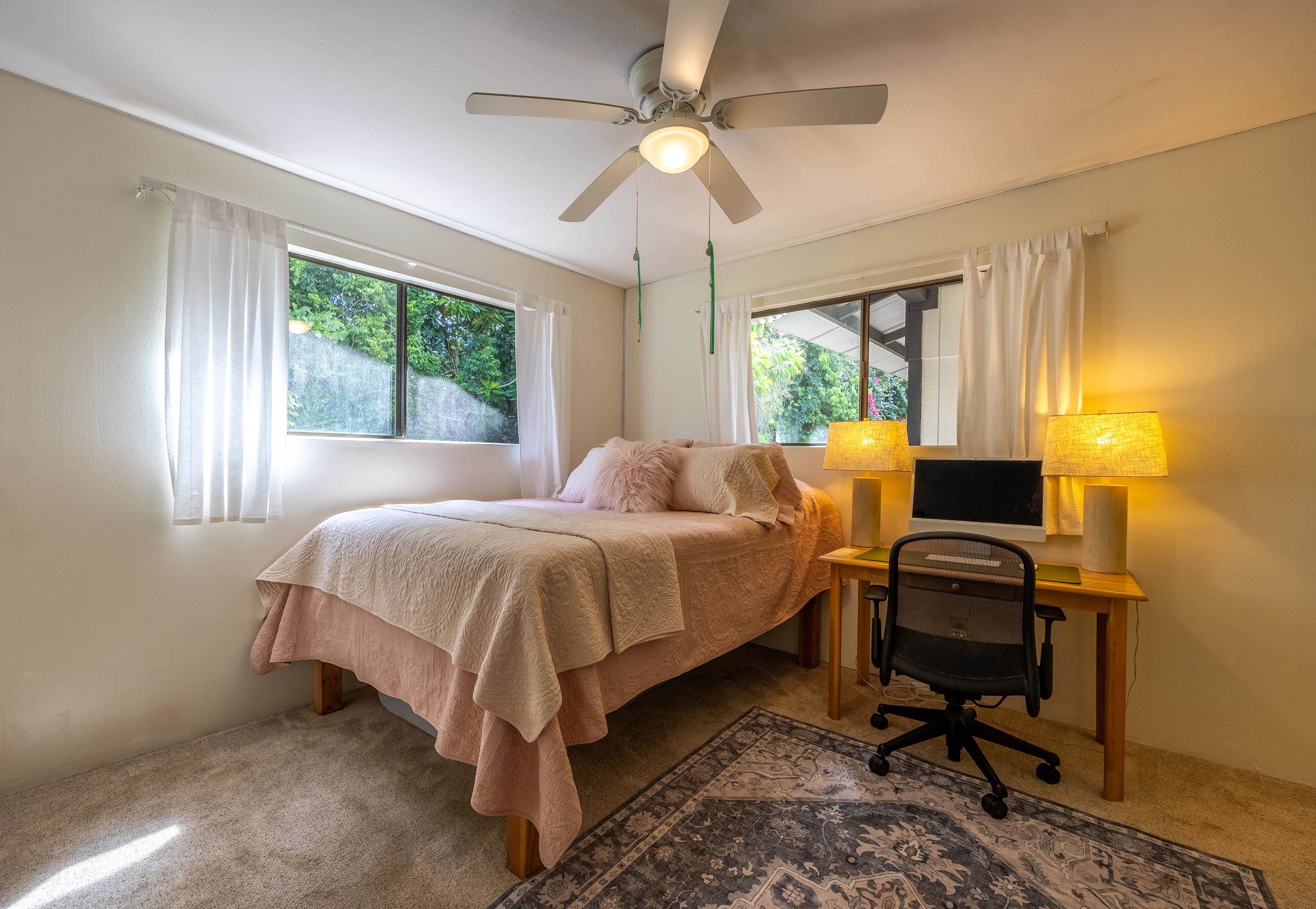 81 Kapuai Road Haiku, HI 96708 - Photo 25 of 50 a bedroom with a bed and a window