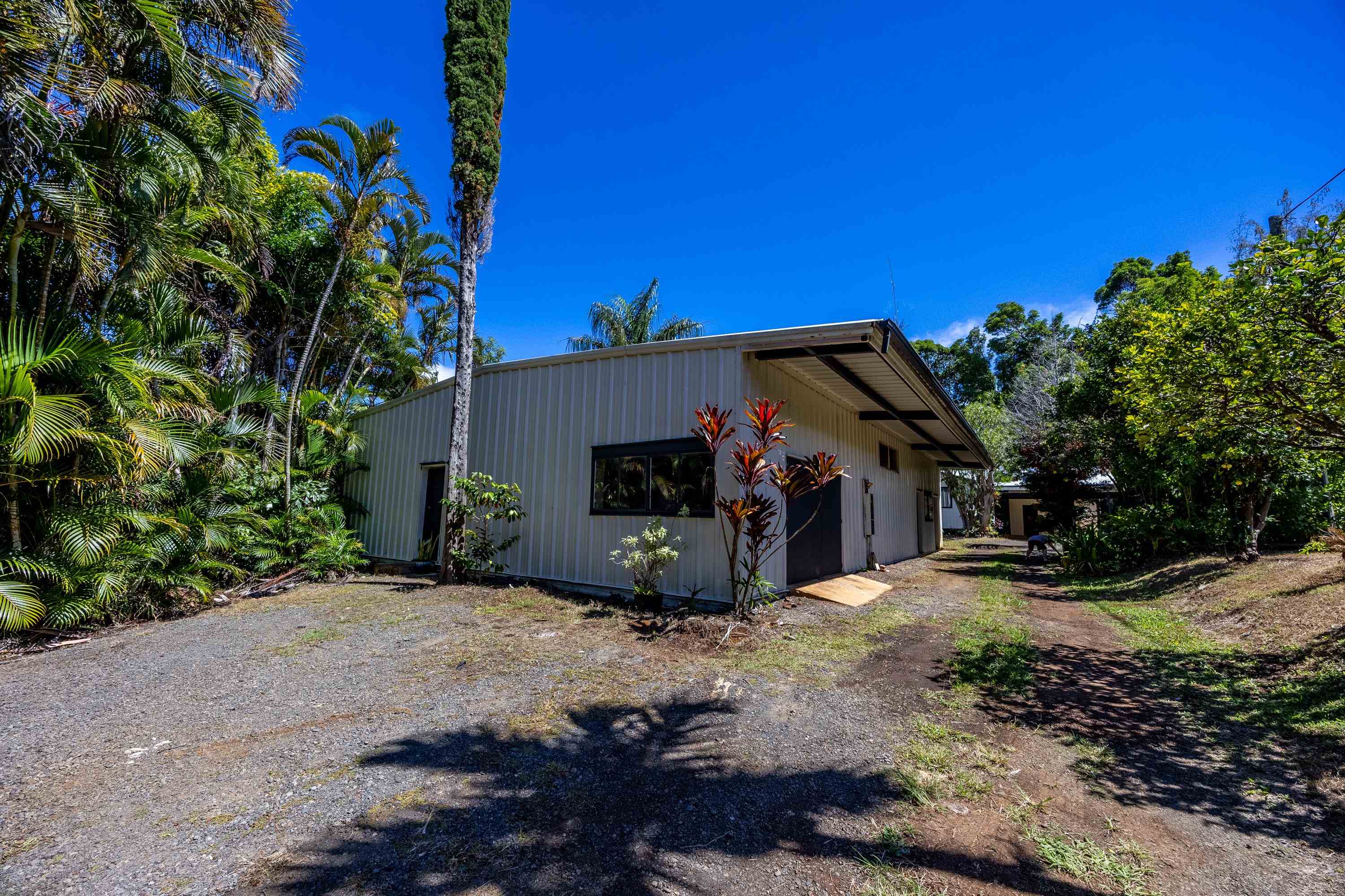 81 Kapuai Road Haiku, HI 96708 - Photo 36 of 50 a view of a house with a tree in the background