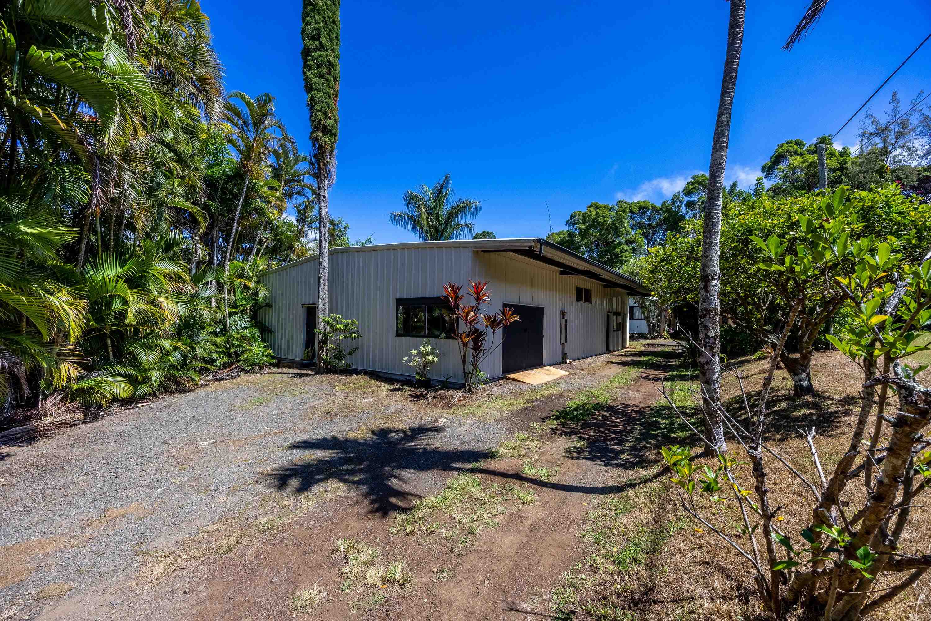 81 Kapuai Road Haiku, HI 96708 - Photo 37 of 50 a view of a house with a tree in the background