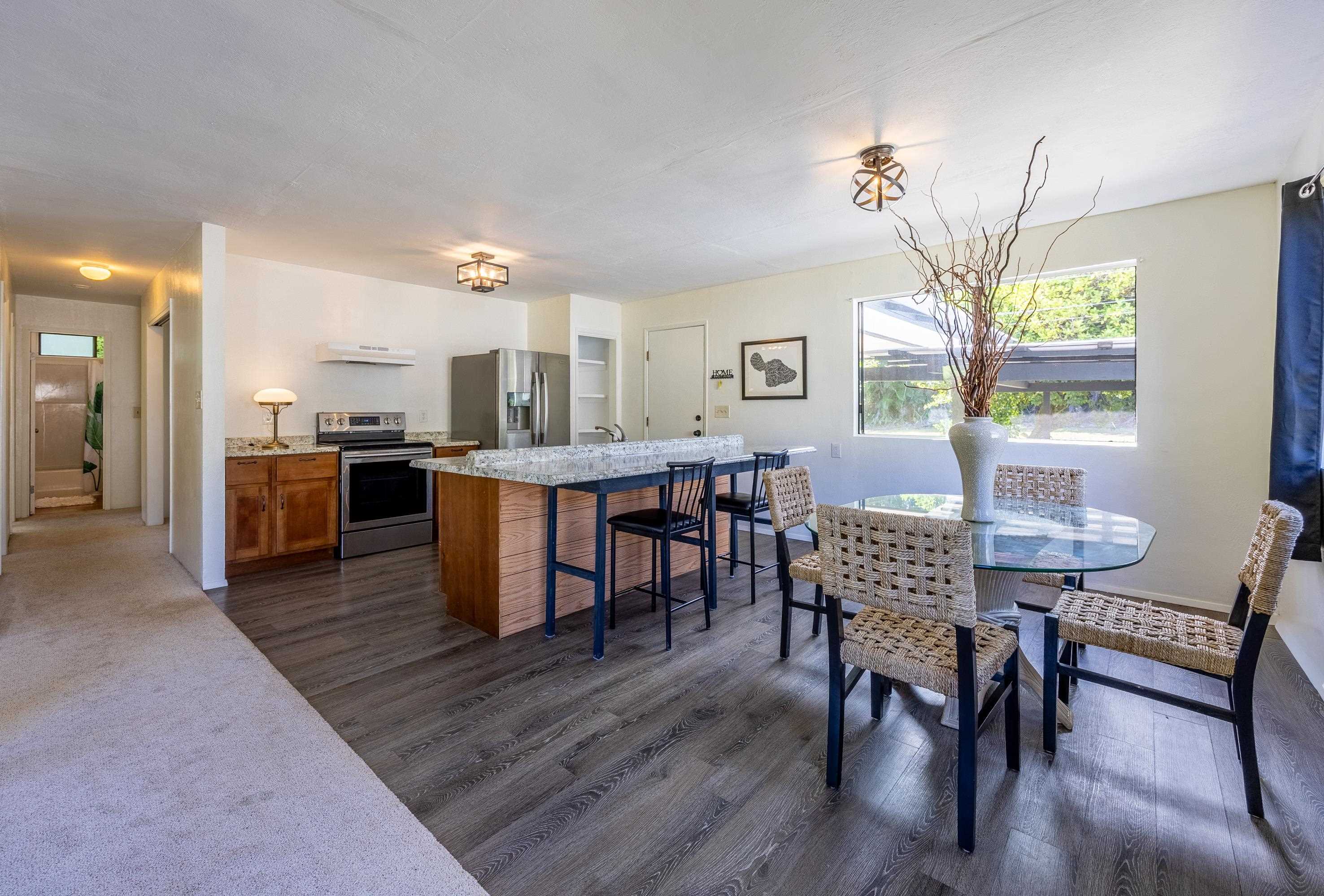 81 Kapuai Road Haiku, HI 96708 - Photo 9 of 50 a dining room with furniture and window