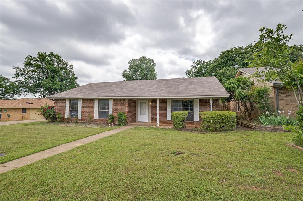 front view of a house with a yard