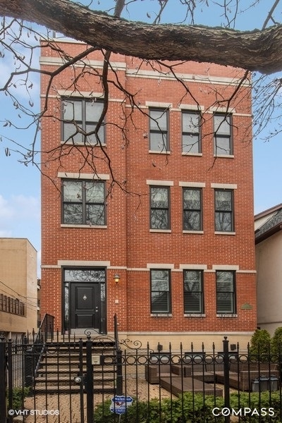 2140 West Schiller Street, Unit 2S Chicago, IL 60622 - Photo 1 of 1 a front view of a building with a lot of windows