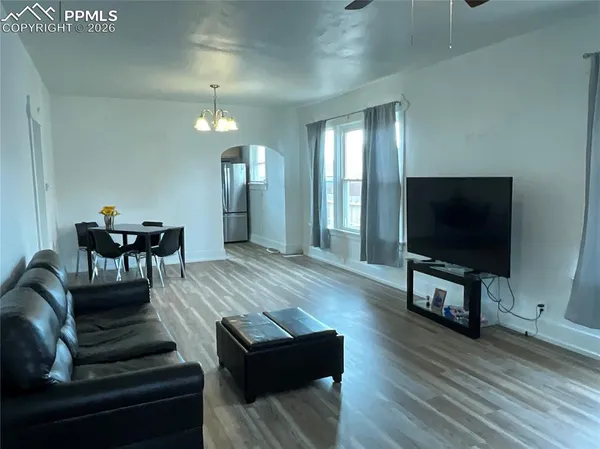 a living room with furniture and a flat screen tv