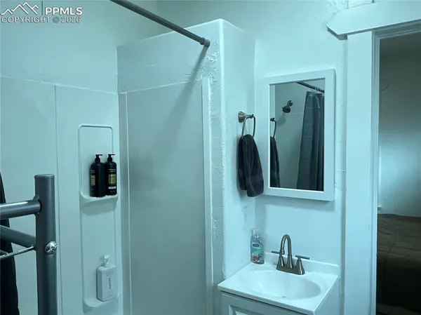 a bathroom with a sink and mirror