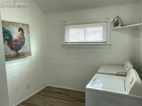 a bathroom with a toilet and a window