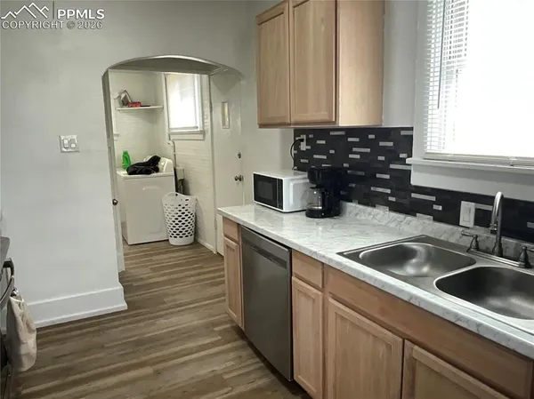 a kitchen with a sink and cabinets