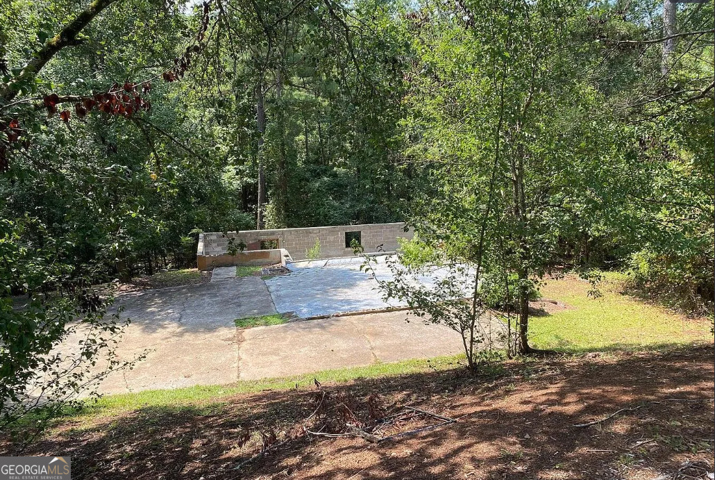 216 River Hills Ridge Road Macon, GA 31211 - Photo 2 of 13 a view of a yard with trees