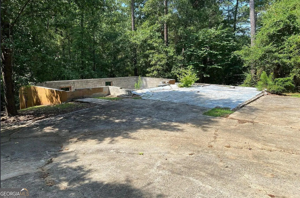 216 River Hills Ridge Road Macon, GA 31211 - Photo 3 of 13 a view of a yard with trees