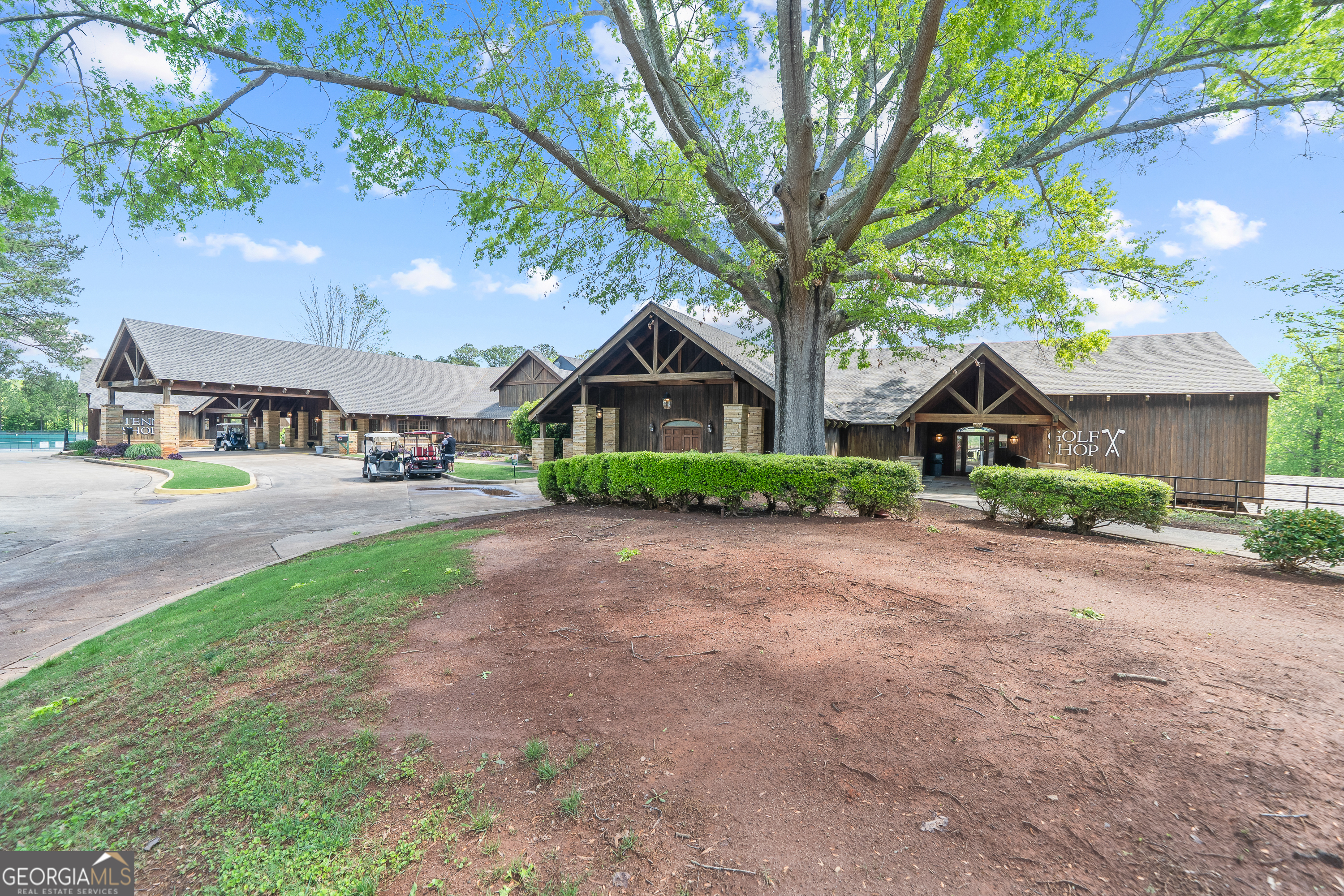 216 River Hills Ridge Road Macon, GA 31211 - Photo 6 of 13 a front view of a house with a yard and trees