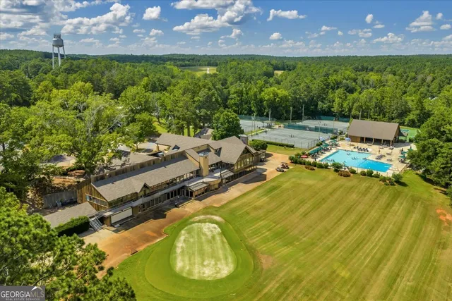 a view of a swimming pool with a yard