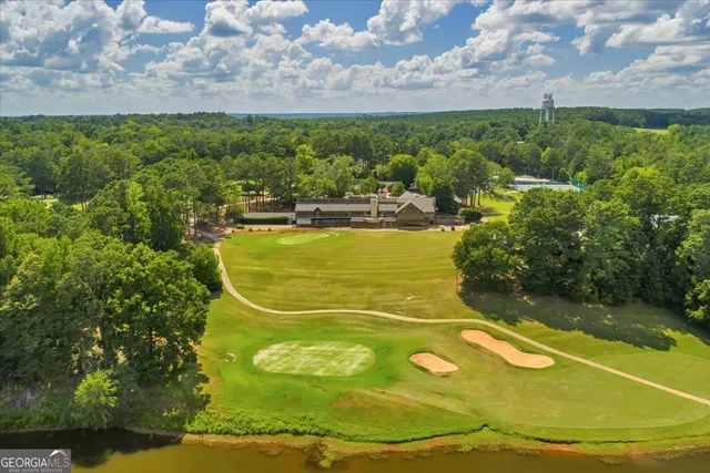 a view of a pool in a backyard