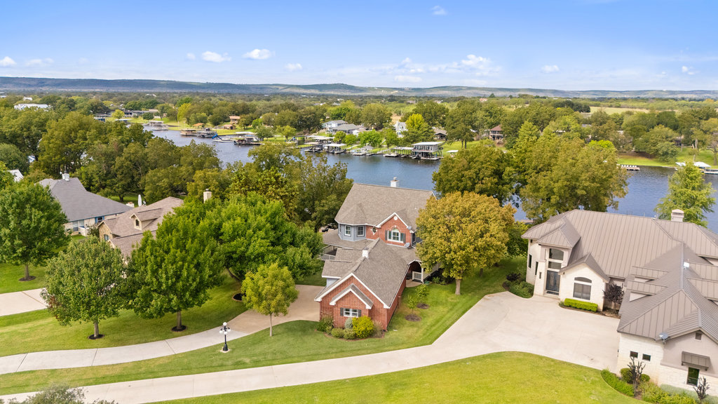 Aerial perspective of suburban area with a large body of water