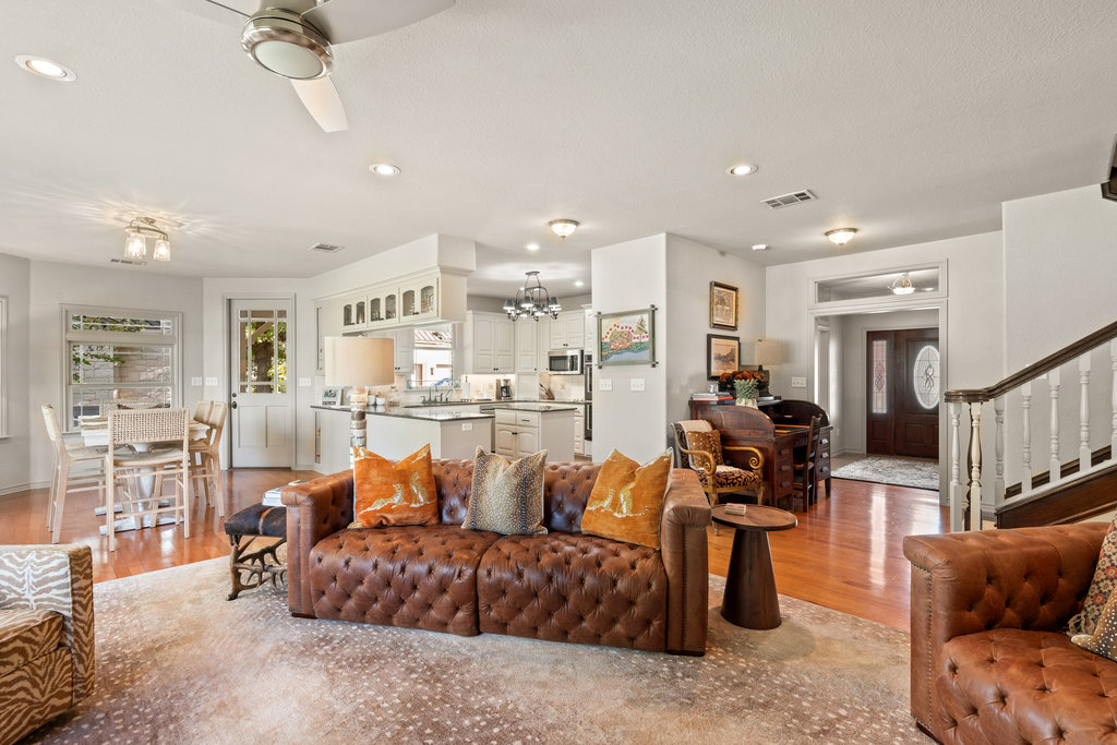 104 River Ranch Road Kingsland, TX 78639 - Photo 15 of 39 Living area featuring stairs, recessed lighting, a chandelier, a ceiling fan, and light wood-style flooring