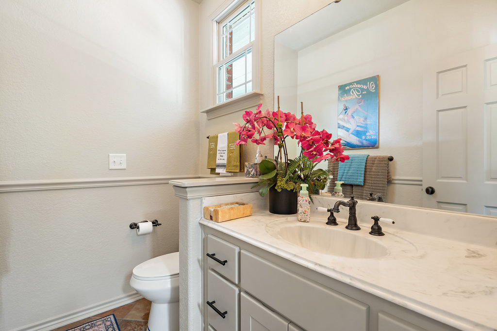104 River Ranch Road Kingsland, TX 78639 - Photo 18 of 39 Bathroom featuring vanity and dark tile patterned flooring
