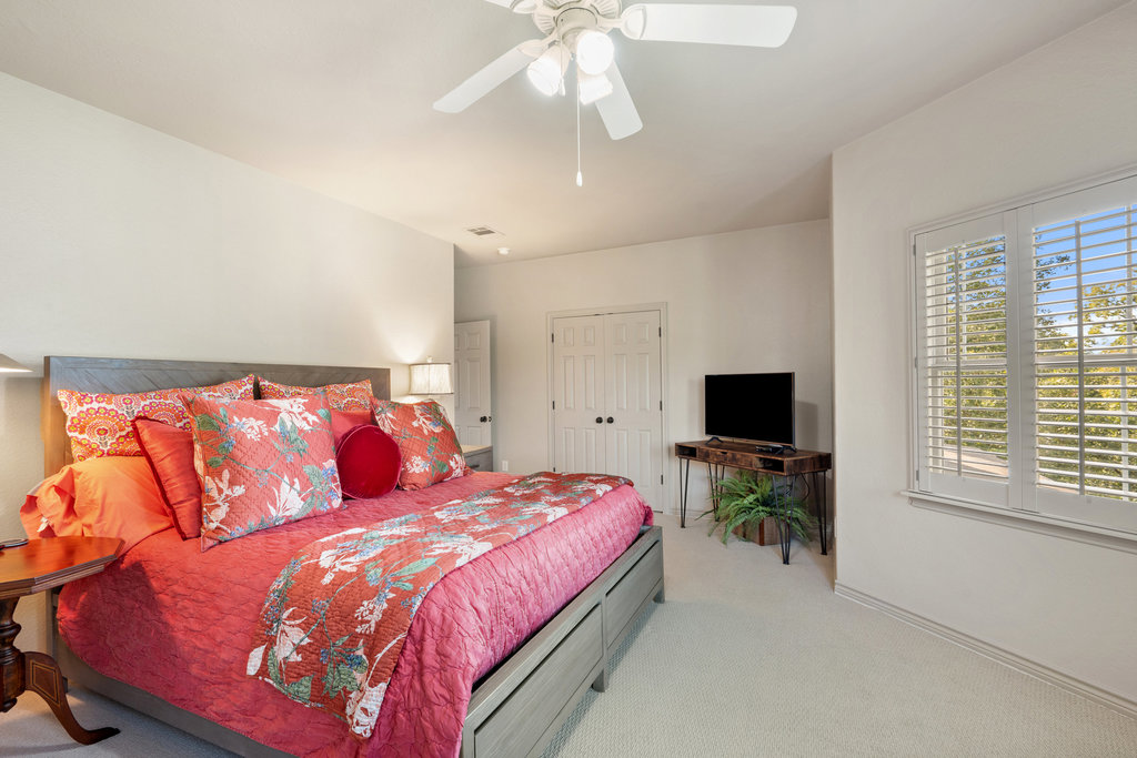 104 River Ranch Road Kingsland, TX 78639 - Photo 21 of 39 Bedroom with carpet, ceiling fan, and a closet