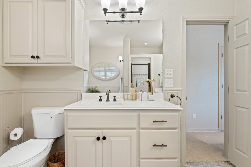 104 River Ranch Road Kingsland, TX 78639 - Photo 22 of 39 Bathroom with vanity and a wainscoted wall