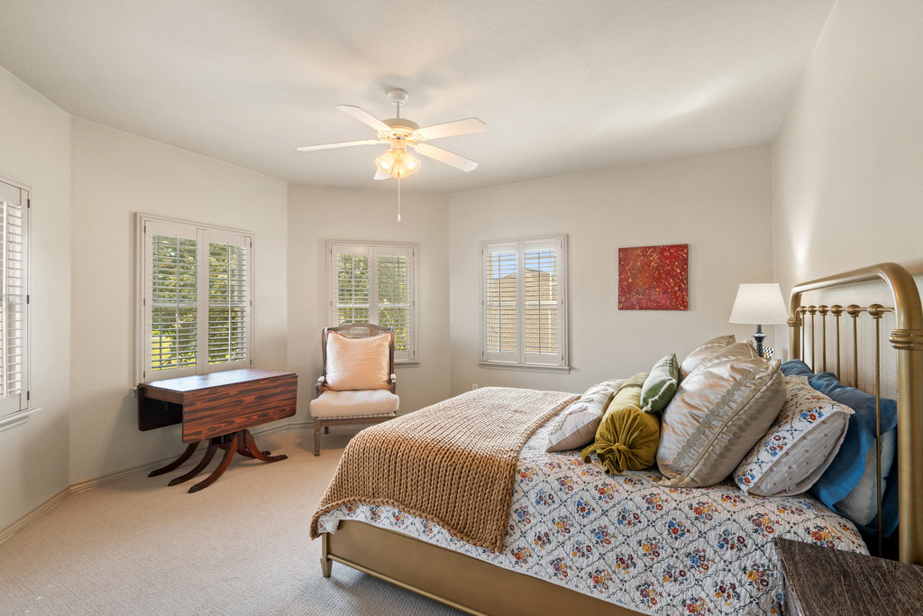 104 River Ranch Road Kingsland, TX 78639 - Photo 25 of 39 Bedroom #3 featuring light carpet, multiple windows, and a ceiling fan