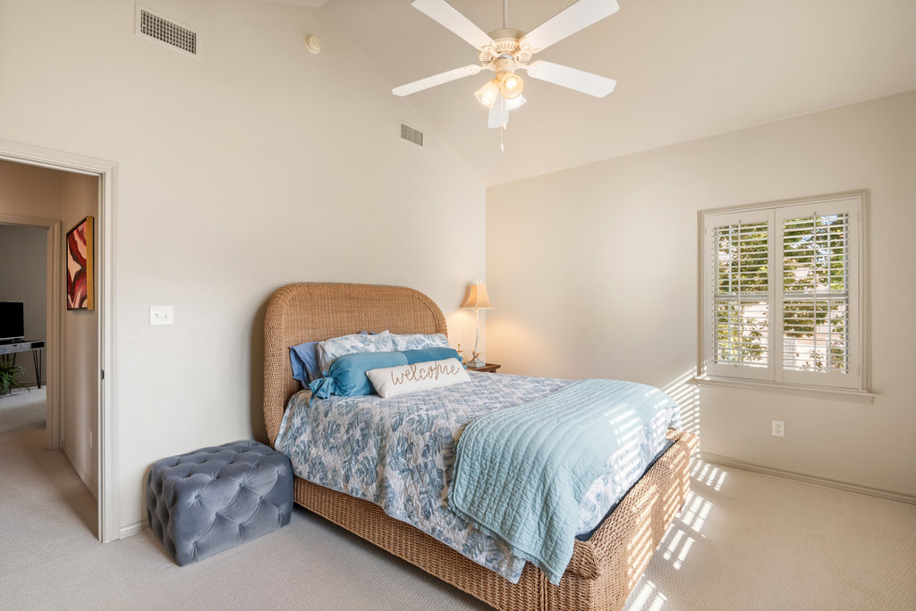 104 River Ranch Road Kingsland, TX 78639 - Photo 26 of 39 Bedroom #4 featuring carpet floors, ceiling fan, and high vaulted ceiling