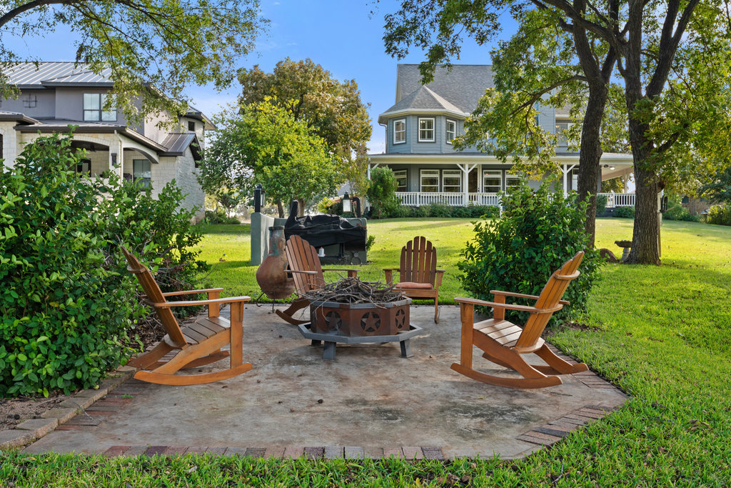 104 River Ranch Road Kingsland, TX 78639 - Photo 32 of 39 View of patio / terrace featuring an outdoor fire pit