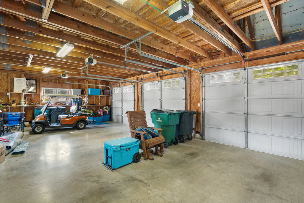 104 River Ranch Road Kingsland, TX 78639 - Photo 36 of 39 Garage featuring a garage door opener