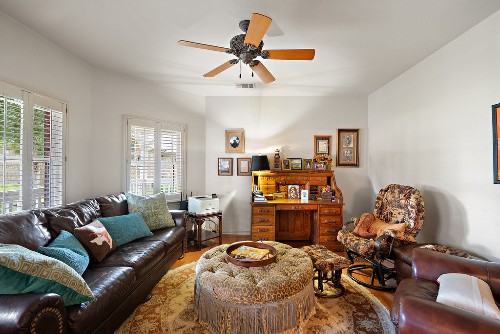 104 River Ranch Road Kingsland, TX 78639 - Photo 8 of 39 Living area with ceiling fan and wood finished floors