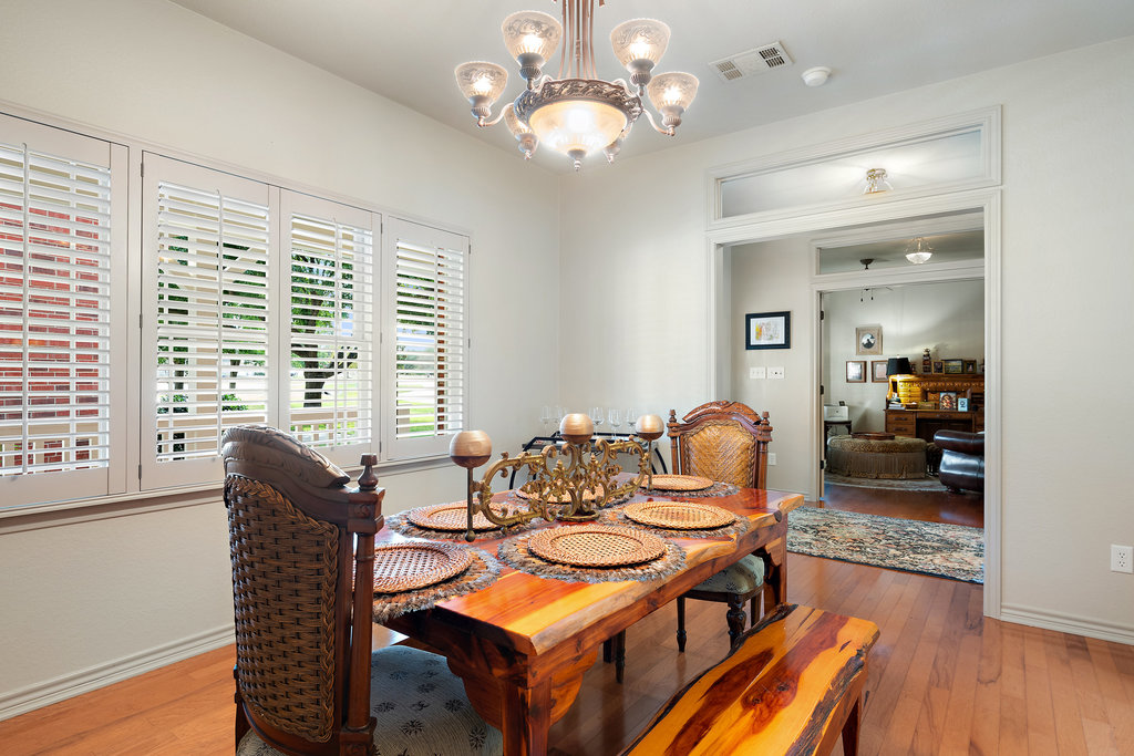104 River Ranch Road Kingsland, TX 78639 - Photo 9 of 39 Dining room featuring a chandelier and hardwood / wood-style floors