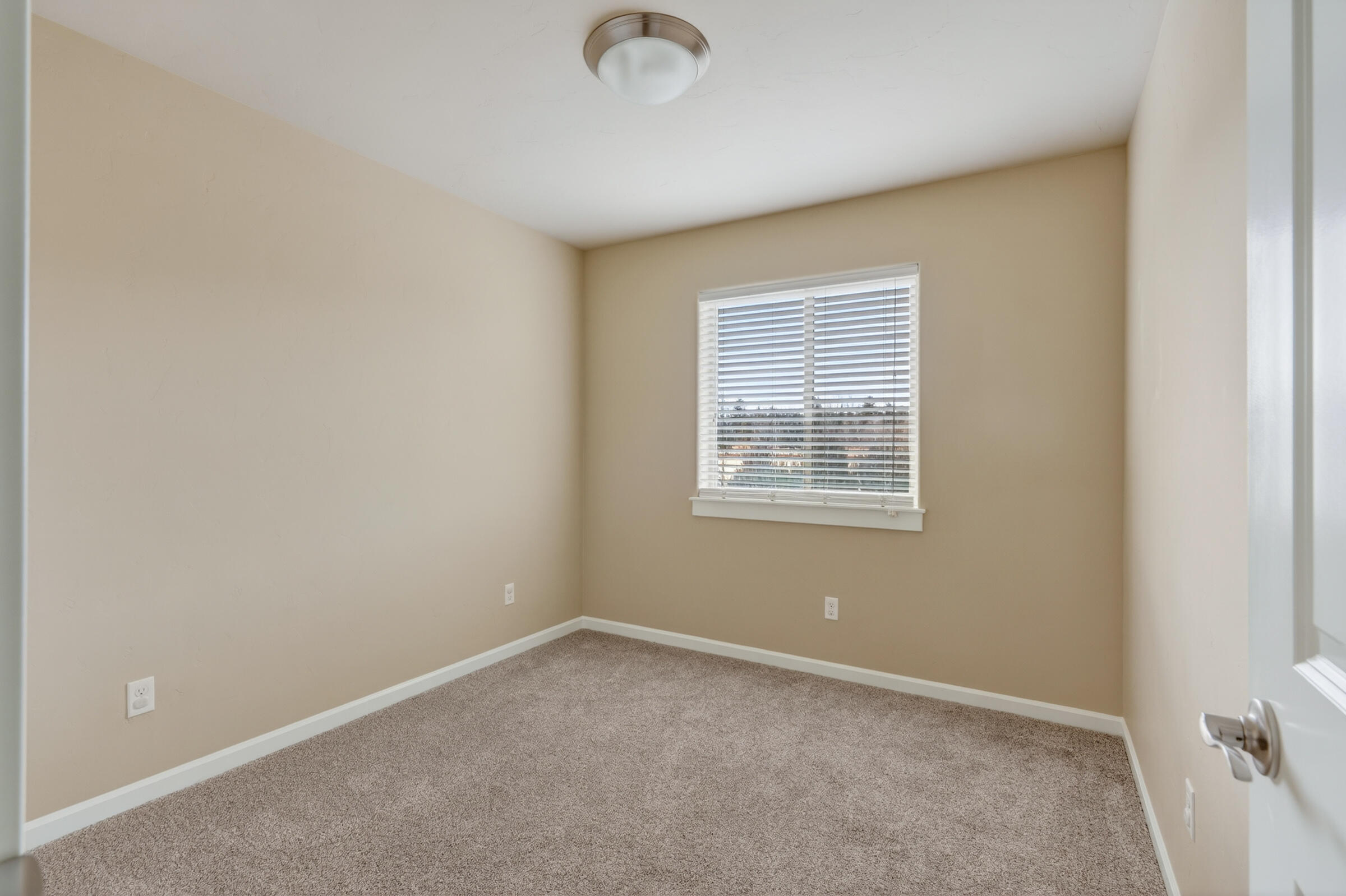 3365 Southwest 28th Street Redmond, OR 97756 - Photo 26 of 39 an empty room with windows