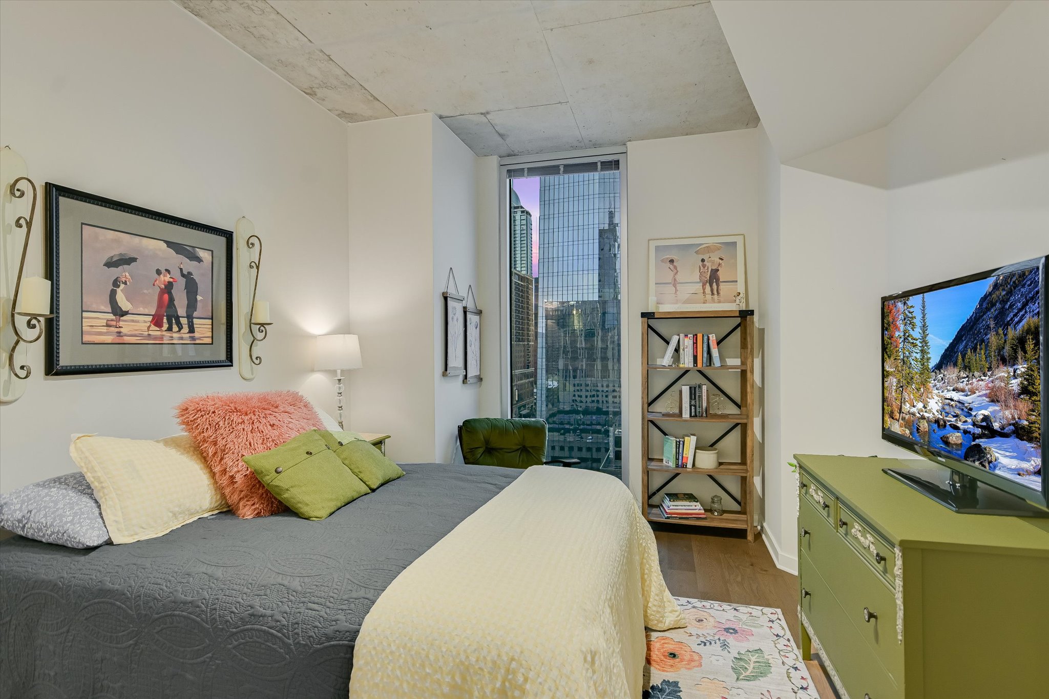 360 Nueces Street, Unit 1405 Austin, TX 78701 - Photo 18 of 40 a bedroom with a bed dresser and flat screen tv