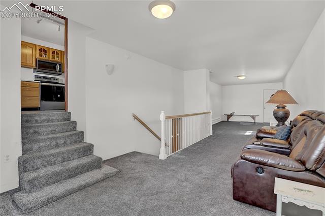 8155 North Log Road Peyton, CO 80831 - Photo 12 of 29 Living room to upper level