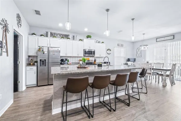 a kitchen with lots of counter space and a sink