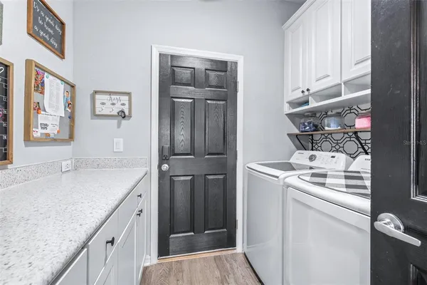 a spacious bedroom with a bed and a ceiling fan
