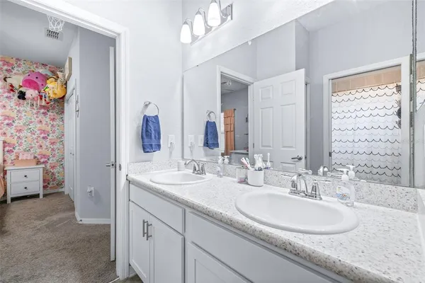 a bathroom with a bathtub and shower curtain