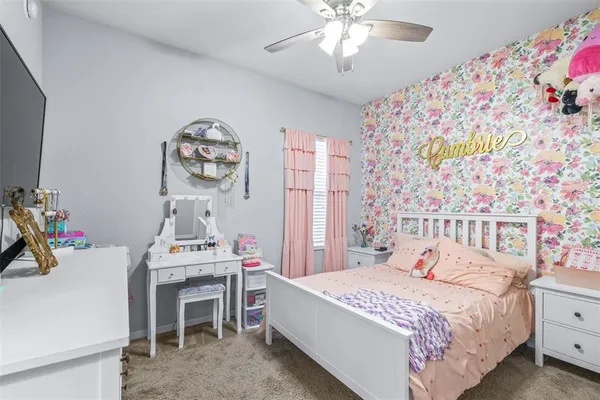 a bed room with a bed and a television