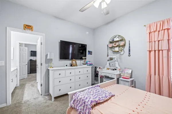 a bedroom with bed and window