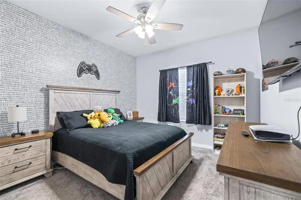 a bedroom with a bed and a dresser