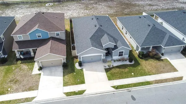 an aerial view of a house with a swimming pool