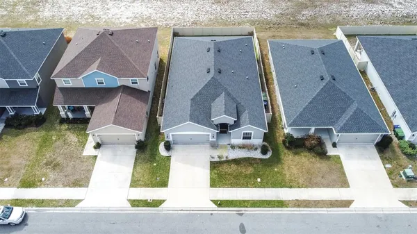 an aerial view of a house with a swimming pool
