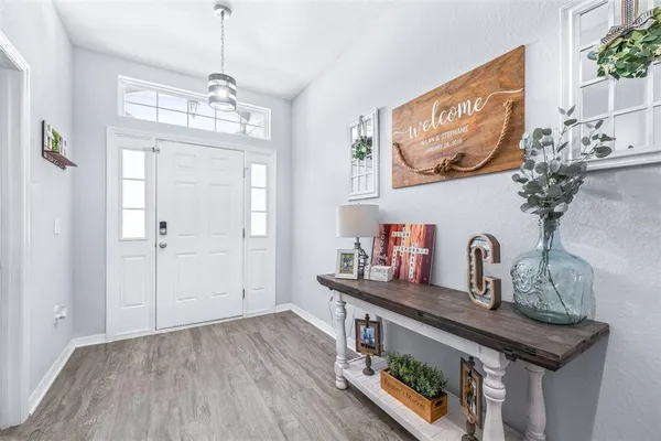 a kitchen with sink and refrigerator