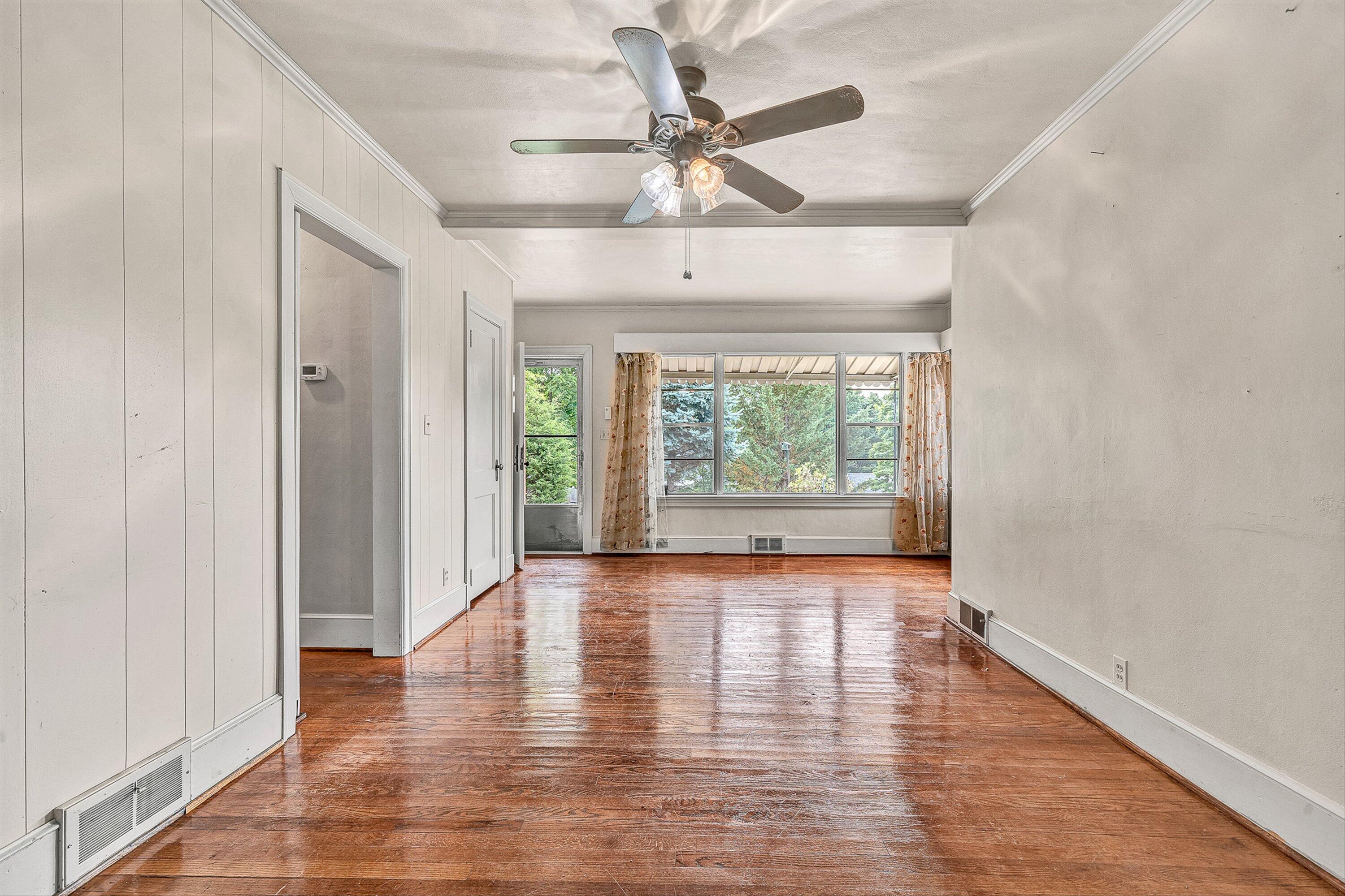 1917 Langdon Road Southwest Roanoke, VA 24015 - Photo 5 of 42 wooden floor in an empty room with a window