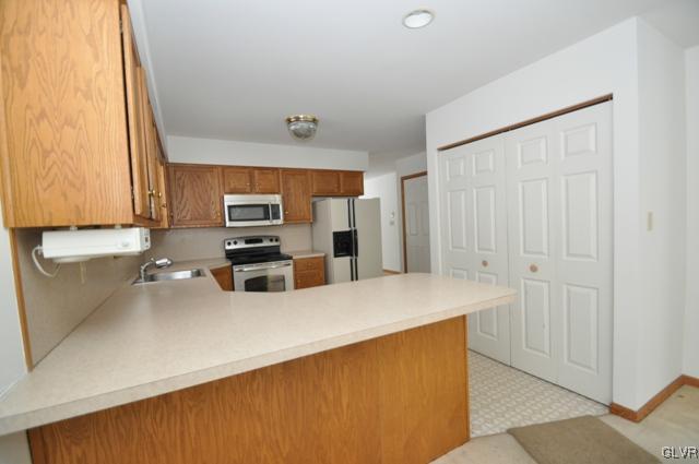 2228 Hill Road Effort, PA 18330 - Photo 8 of 50 a kitchen with stainless steel appliances a refrigerator and a stove