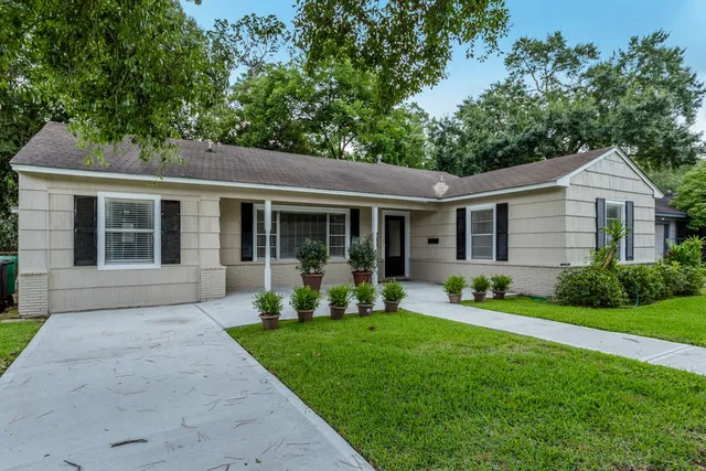 front view of a house that has a yard