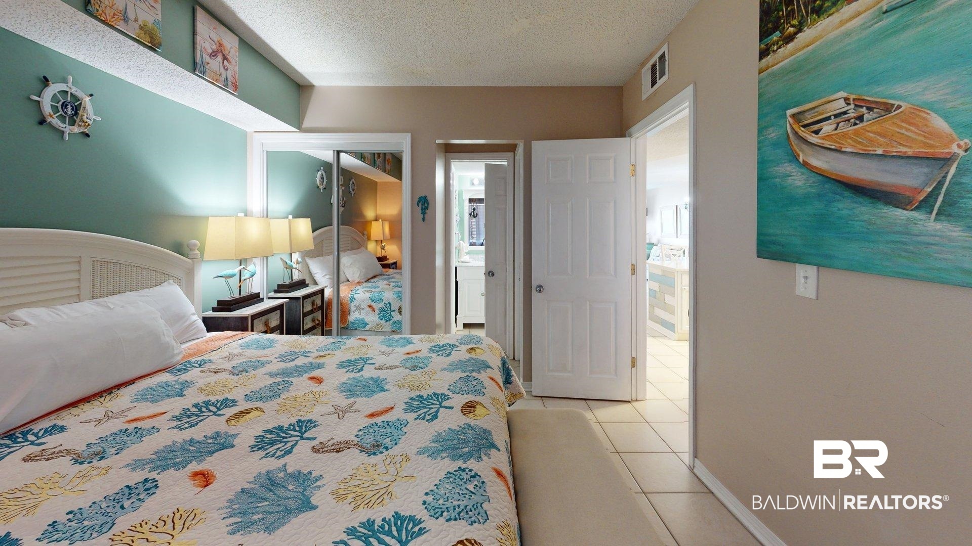 645 Plantation Road, Unit 6503 Gulf Shores, AL 36542 - Photo 8 of 53 Bedroom featuring a textured ceiling, a closet, and light tile patterned flooring