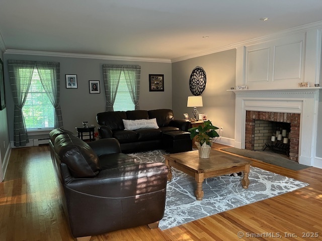 47 Merwin Brook Road Brookfield, CT 06804 - Photo 7 of 29 a living room with furniture and a fireplace
