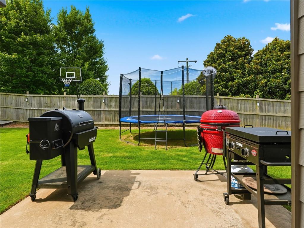 147 Fieldbrook Crossing Canton, GA 30115 - Photo 35 of 46 a patio with table and chairs