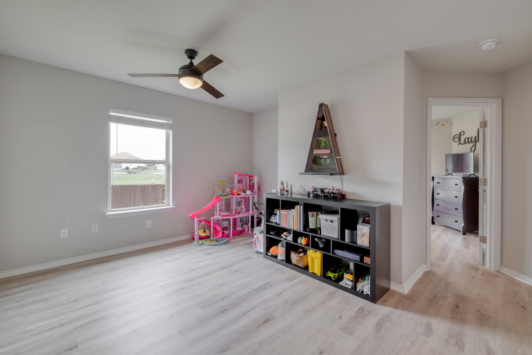 1000 Bright Star Cove Georgetown, TX 78628 - Photo 25 of 40 a living room with furniture and a book shelf