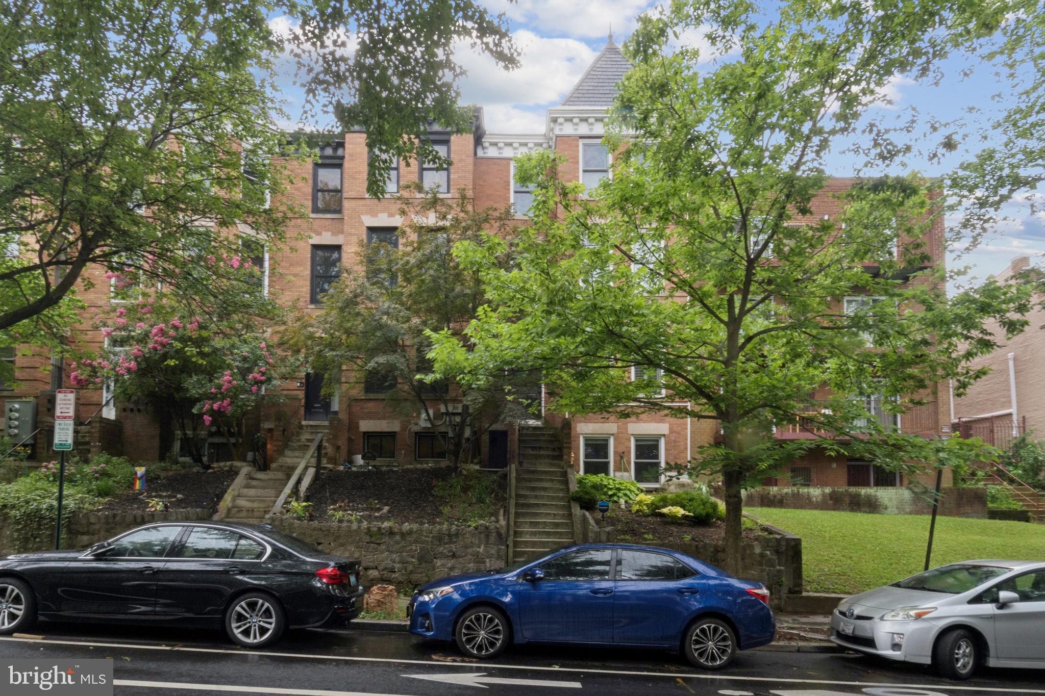 1682 Irving Street Northwest, Unit 2 Washington, DC 20010 - Photo 1 of 25 a car parked in front of a parked cars parked in front of a building